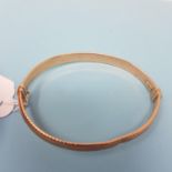 A 9ct gold bangle, 7.1g