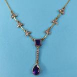 A modern gold plated Art Nouveau style pendant necklace inset with purple and white stones Report by