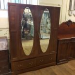 An oak dresser, 125 cm wide, an oak dropleaf table, a mahogany wardrobe, 148 cm wide an oak chest of