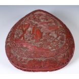 A Chinese red cinnabar lacquer box and cover of heart form, decorated figures in a landscape