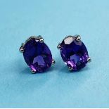 A pair of amethyst stud earrings