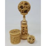 An early 20th century Cantonese carved and pierced ivory concentric ball on stand, 16 cm high, a