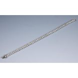 A 14ct white gold and round brilliant cut diamond line bracelet Report by JS Diamond weight