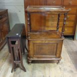 A 19th century walnut music cabinet, 61 cm wide, and a walnut table (2)