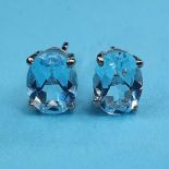 A pair of blue topaz stud earrings