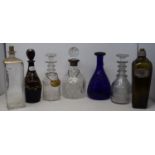 An early 19th century decanter, highlighted in gilt, 25 cm high, three glass decanters, and three