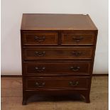 A mahogany chest, having two short and three long drawers, 60 cm wide, and a Singer sewing