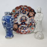 A Chinese blanc de chine figure, 30 cm high, an Imari plate blue and a Chinese vase (3) damages/