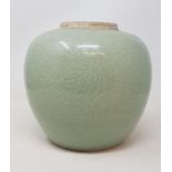 A Chinese celadon ground ginger jar, having incised decoration with scrolling flowers and foliage,