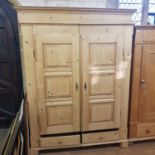A pine wardrobe, 146 cm wide, and a pine hall cupboard, 95 cm wide