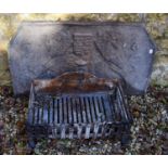 A cast iron fire back, 105 cm wide, and a fire basket