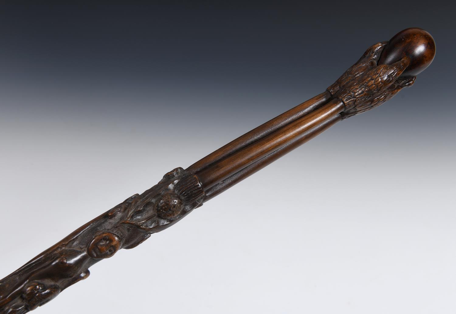 A 19th century folk art walking stick, the handle carved in the form of a talon gripping an egg, - Image 2 of 12