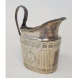 A George III silver milk jug, crested, and with engraved decoration, marks rubbed, 4.8 ozt