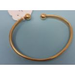 A 9ct gold bangle, 6.8 g 68 mm x 53 mm internal diameter.