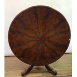 A 19th century mahogany tilt top breakfast table, with a segmented top, on carved column support
