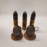 A pair of hand grenade shells on mounts and various cartridge shells cases , (box) The tallest 56cm