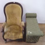 A 19th century mahogany button back armchair, having scrolled arms, on turned tapering legs to