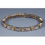 A 14ct mixed gold and diamond line bracelet, diamonds approx. 8ct