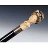 A 19th century walking stick, with a carved Japanese ivory handle in the form of a Bijn, inset