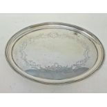 An oval silver tray, decorated a bow, flowers and foliage, Sheffield 1904, 11.6 ozt, 29 cm wide