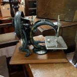 A 19th century Willcox and Gibbs sewing machine in, and a Singer sewing machine (2) Movement is