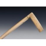 A 19th century walking stick, with a marine ivory handle on a whalebone cane, 93 cm