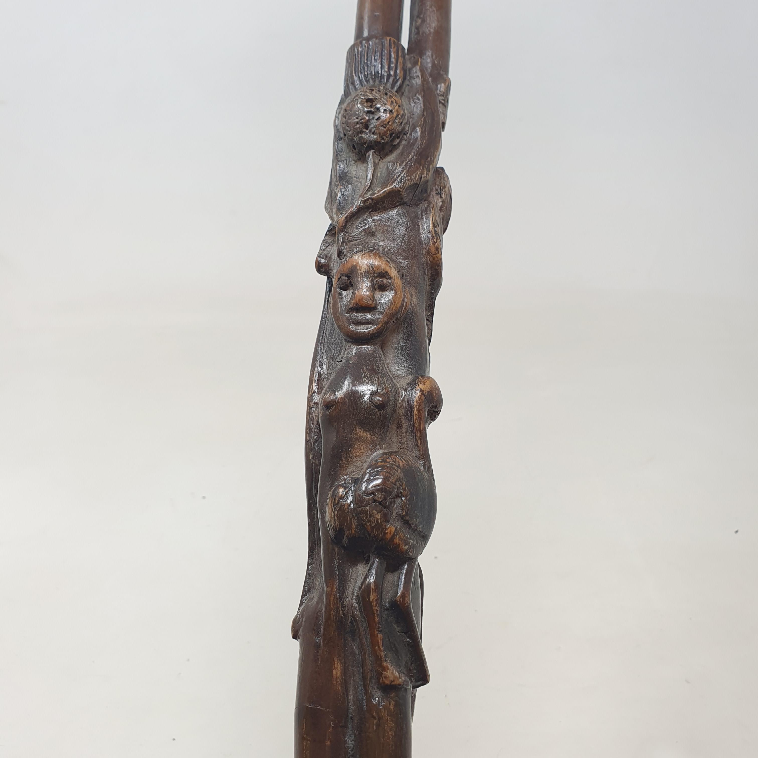 A 19th century folk art walking stick, the handle carved in the form of a talon gripping an egg, - Image 10 of 12