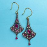 A pair of flared drop earrings, set with rubies and diamonds
