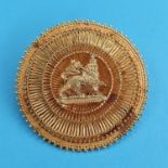 An Eastern yellow metal brooch, decorated with lion, 4 cm diameter Report by JS Unmarked, untested