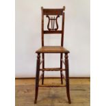 A 19th century beech child's deportment chair
