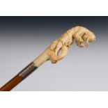 A 19th century walking stick, with a carved ivory handle depicting Sherlock Holmes with a