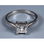 A white gold and solitaire princess cut diamond ring, ring size L Size of stone approx. 3.24mm deep,