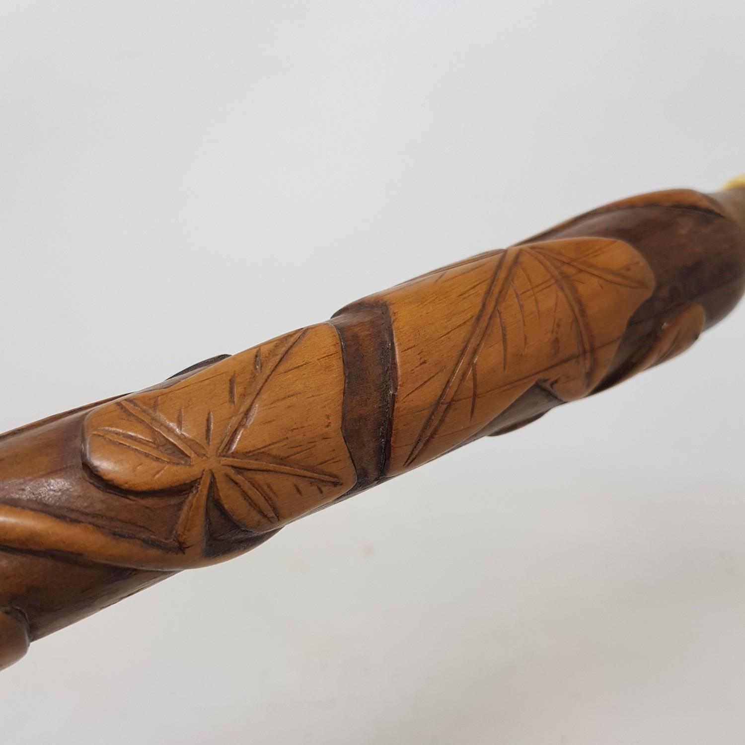 An Early 20th century walking stick, with carved ivory handle in the from of a hand, on a foliate - Image 4 of 6