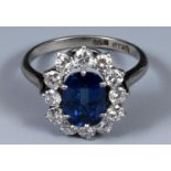 An 18ct white gold, sapphire and diamond ring, ring size M Central stone approx. 2.5cts and 1ct of