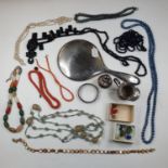A coral bead necklace, another, other necklaces, a silver mounted mirror and items