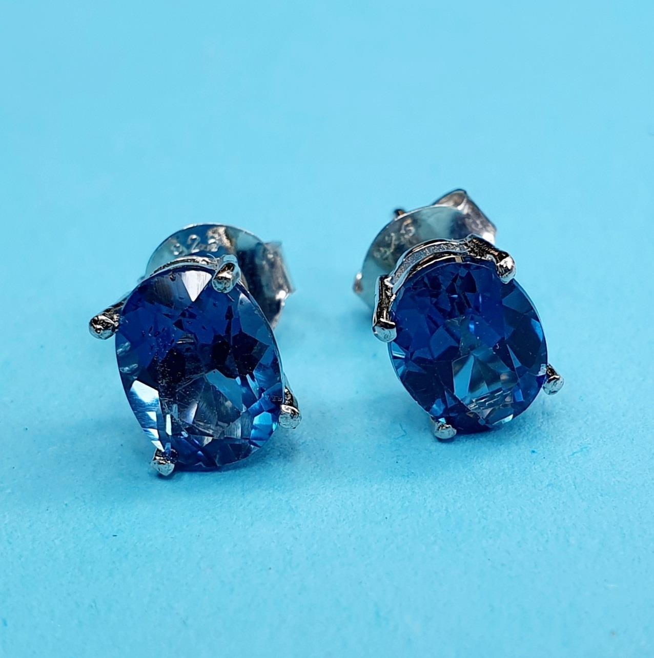 A pair of topaz stud earrings