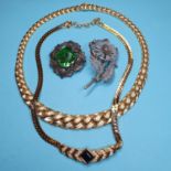 A Christian Dior gold plated necklace, another necklace and two brooches (4)