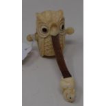 A modern bone owl form tape measure, 6 cm high Report by JS Note: this is 20th/21st century copy