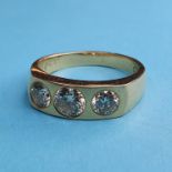 An 18ct gold and three stone diamond gypsy set ring, ring size approx. U central stone, 6.2mm