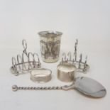 A small pair of silver toast racks, Birmingham 1918, two silver napkin rings, a silver spoon, 6.0