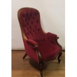 A 19th century mahogany button back armchair