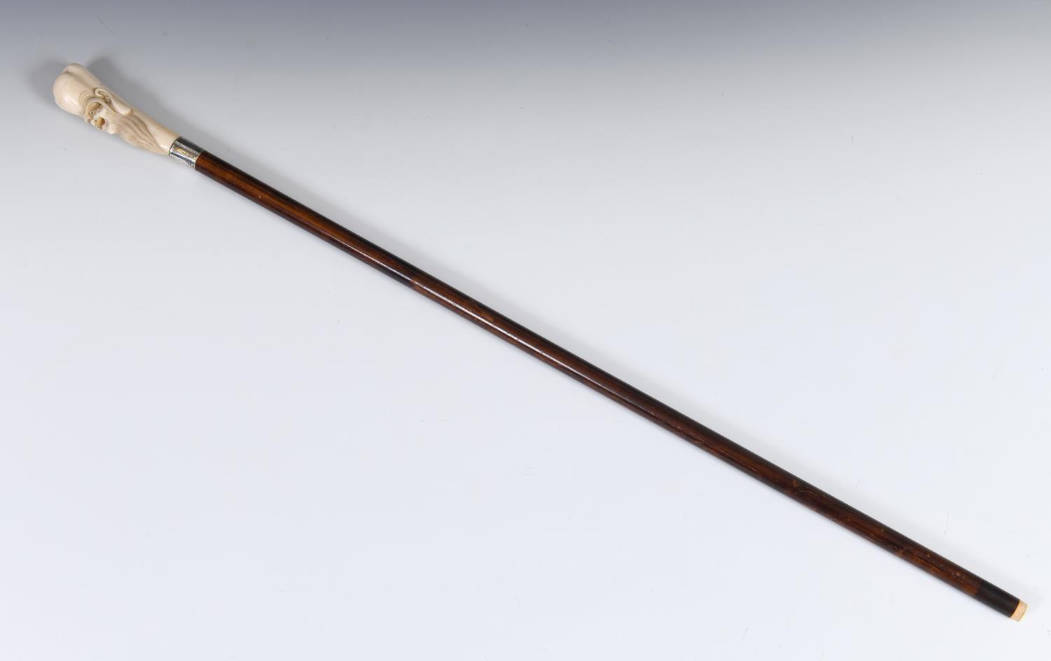 A 19th century walking stick, with a Japanese carved ivory handle in the form of Fukurokuju, on a - Image 2 of 2