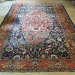 A Ziegler blue ground carpet, main red floral border, centre with shaped medallion, 244 x 350 cm