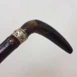 An Early 20th century French horse measuring walking stick, with horn handle, on a bamboo shaft,