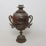 A 19th century Burmese silver coloured metal and coconut trophy cup and cover, 29 cm high