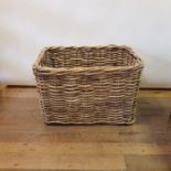 A wicker log basket, 93 cm wide, an oak side table, a child's high chair, a giltwood screen frame,