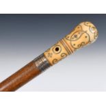 A 17th century walking stick, with a pique decorated ivory handle 'LT & OB 1691' with a white