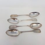 A Victorian silver fiddle pattern serving spoon, London 1873, and three others, various dates and