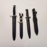 A reproduction Third Reich dagger, 26 cm and three other daggers (4)