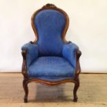 A 19th century mahogany armchair, on cabriole legs